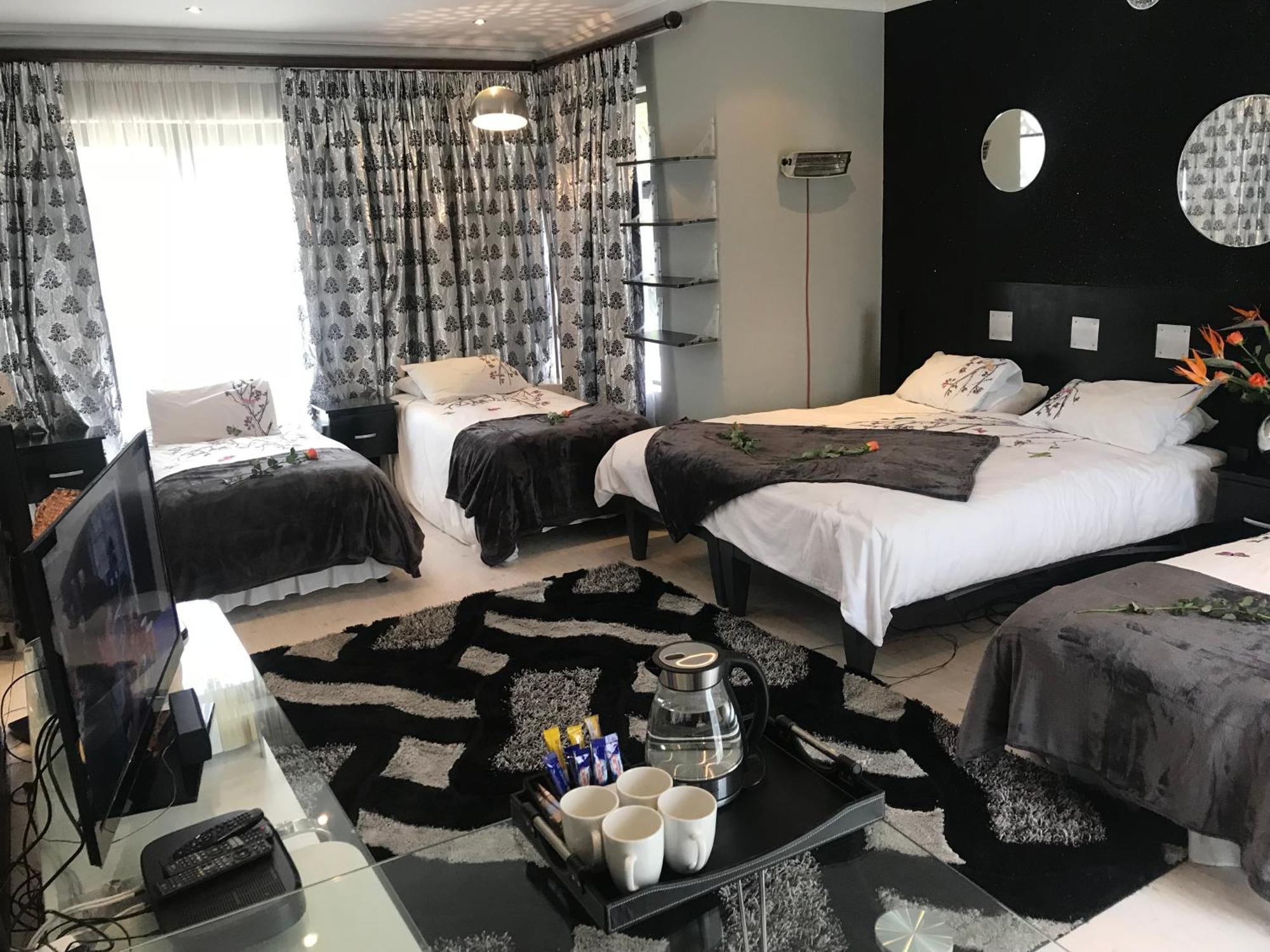 Africa Paradise - Or Tambo Airport Boutique Hotel Benoni Rum bild
